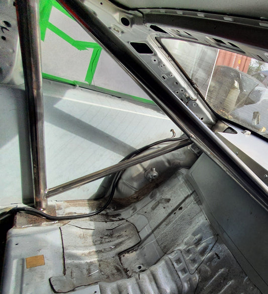 Interior of stripped out drift car with custom metal interior pieces fitted