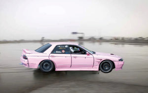 Drift car on wet skid pan